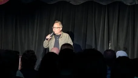 Performer with a microphone in front of an audience